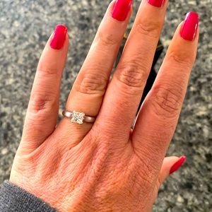 .97 real diamond princess cut. Platinum setting, white gold band. Size 7 3/4.